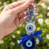 Evil Eye Wall Hanging with Om Symbol, Blue, Silver Beads, Decorative Charm, Protection Amulet Door Hanging Nazar Batu for Protection and Good Luck - Perfect for Gifting Home