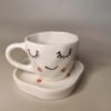 Decoroid Handcrafted White Ceramic Cup Handcrafted White Ceramic Cup & Saucer Set – Cute Sleepy Face Print Tea Cup for Kitchen & Table Décor